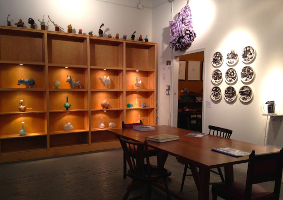 Installation view with Shari Mendelsohn's work on shelves.