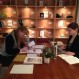 Eliza Martin consults with the Work Intern (Meredith Degyansky, right)